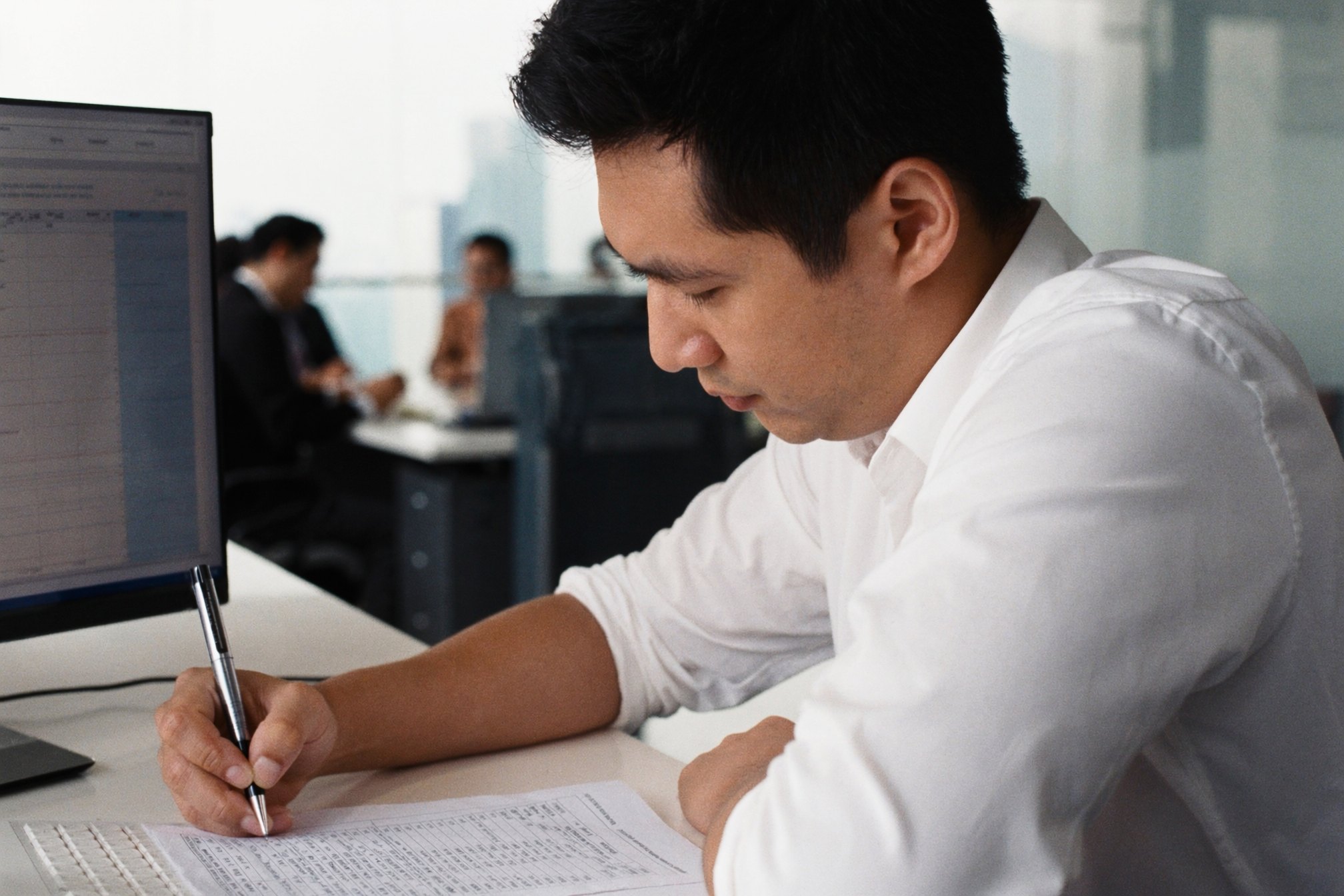 Property manager reviewing lease data at a desk.